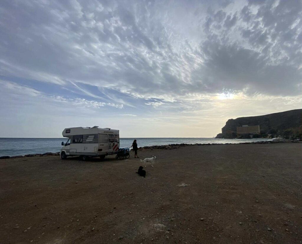 Slow travelling in Spain, wild camping at the beach working on quiet productivity while enjoying slow living